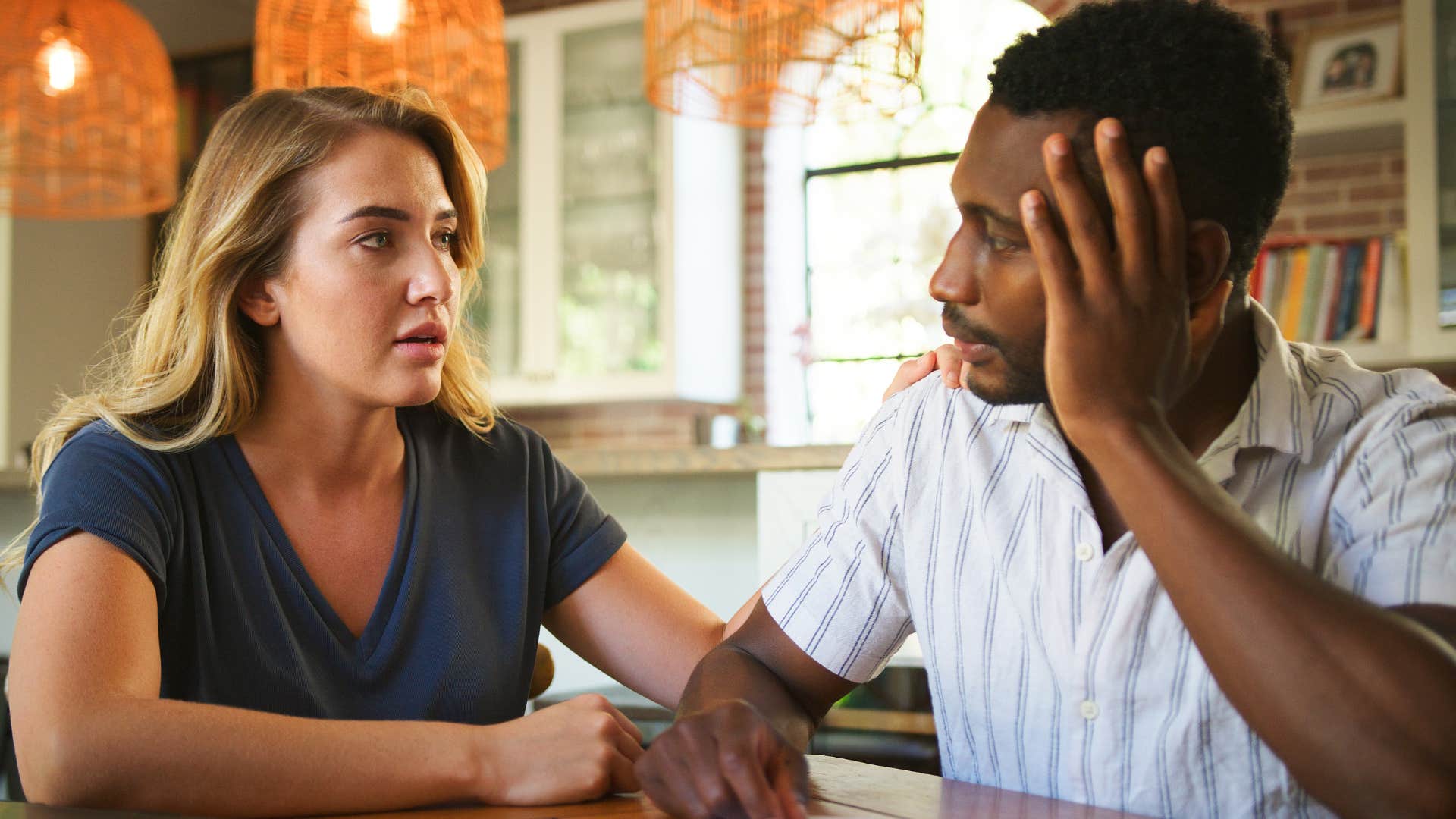 Man saying "I need more space" to his upset wife.