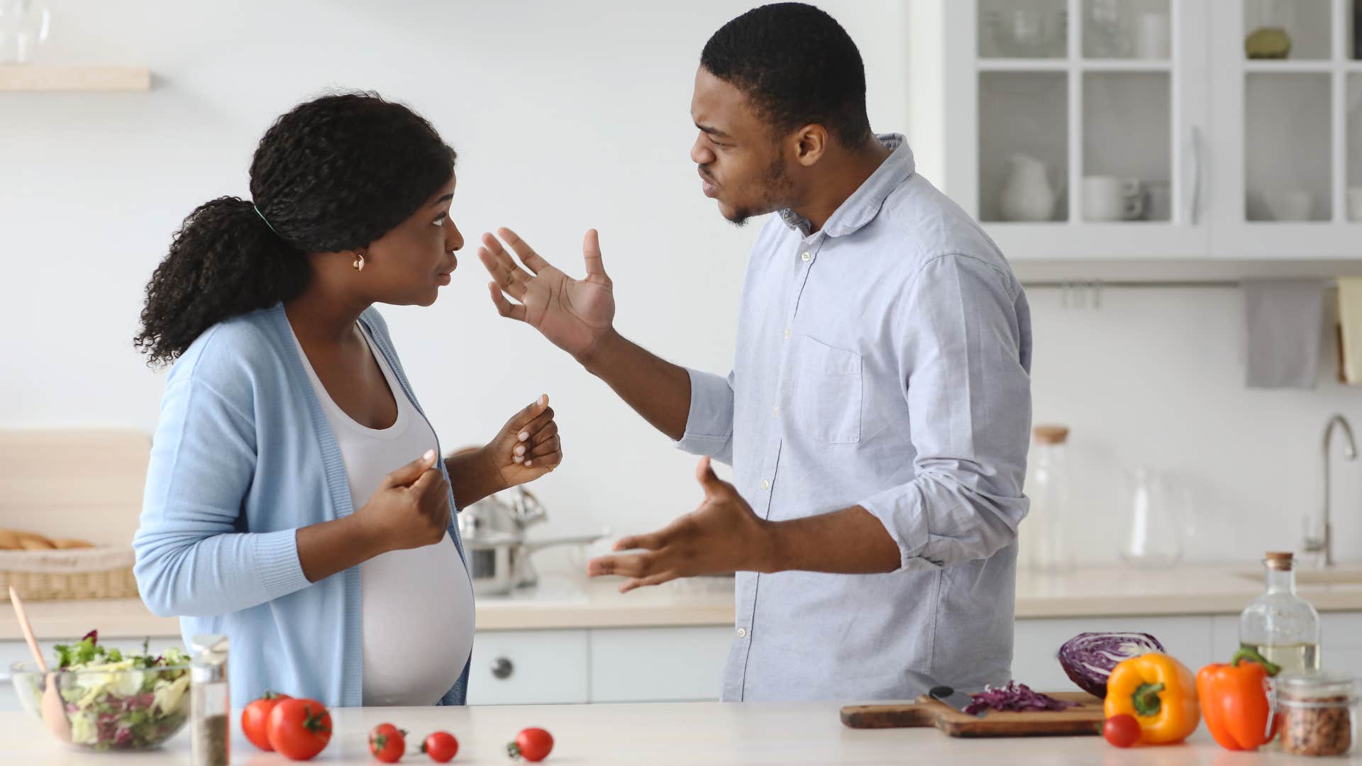 man is acting passive aggressively towards his wife at home because he resents her