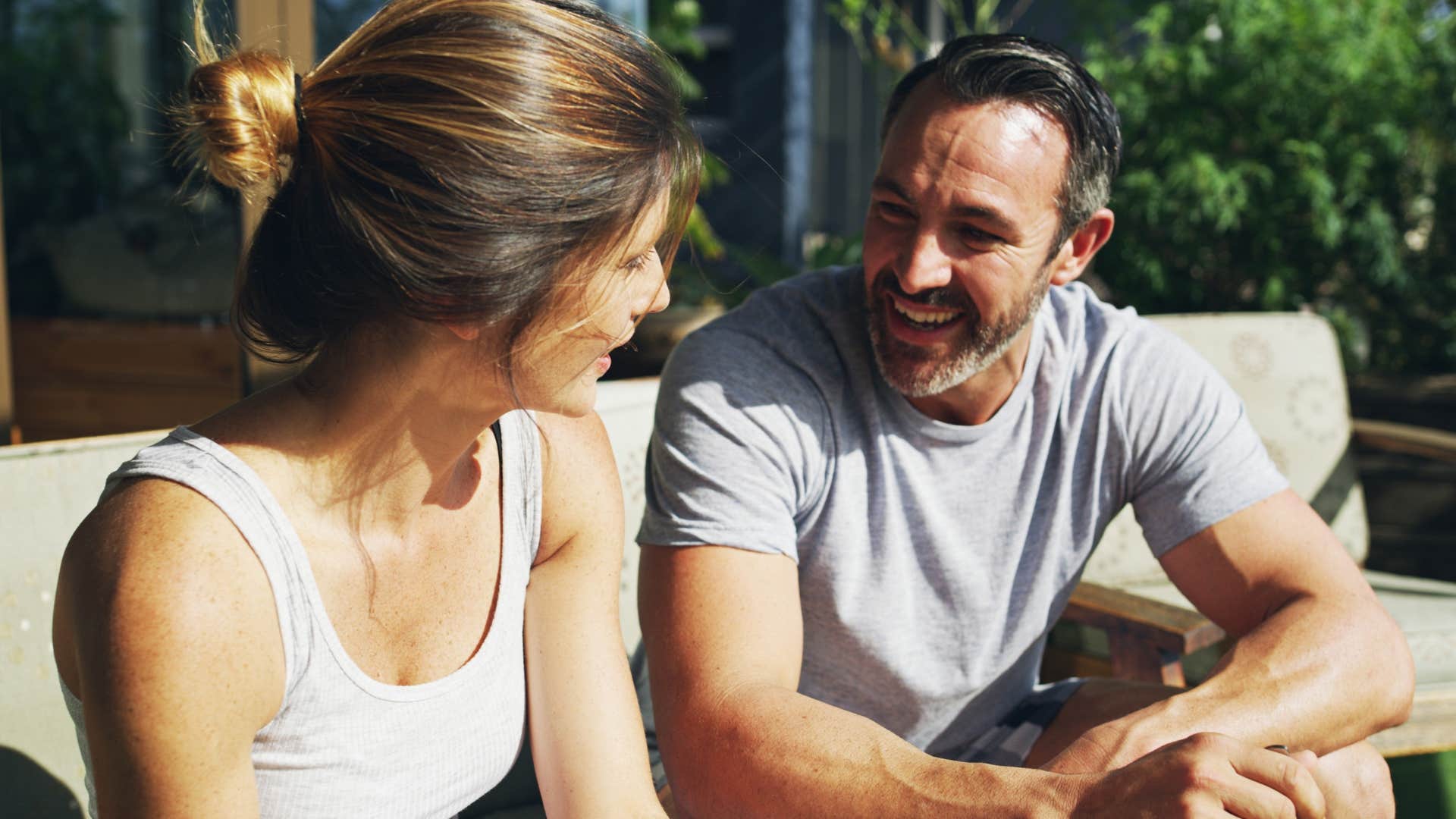 Man encouraging their partner to set lofty goals outside.
