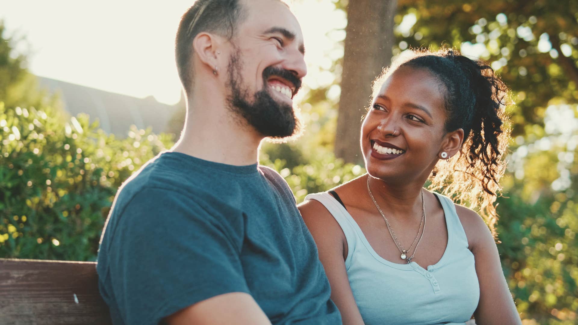 Man who gives compliments smiling with his wife.