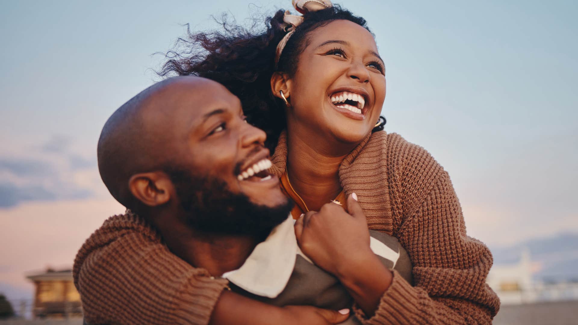 Woman smiling and hugging her husband who keeps their promises.