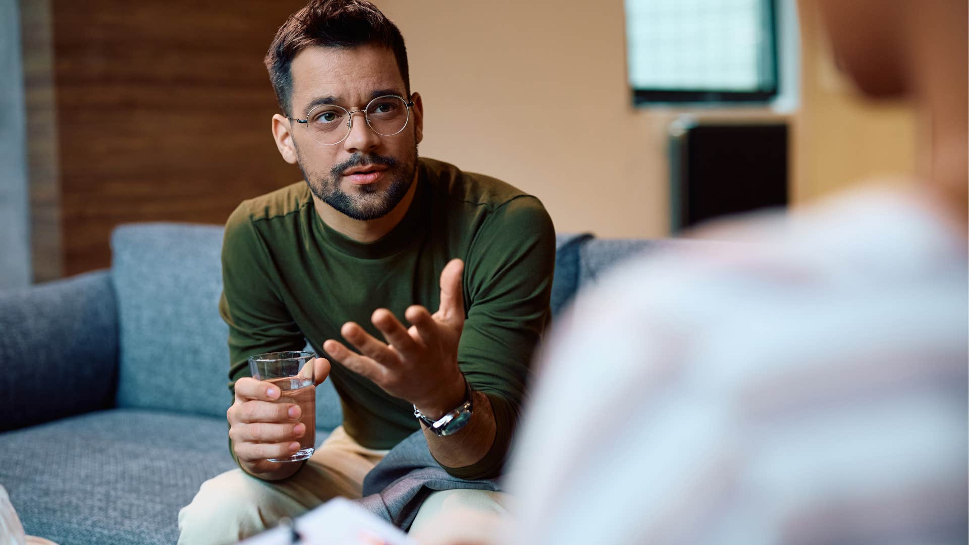 Man who can prioritize their own growth and stability talking in therapy.