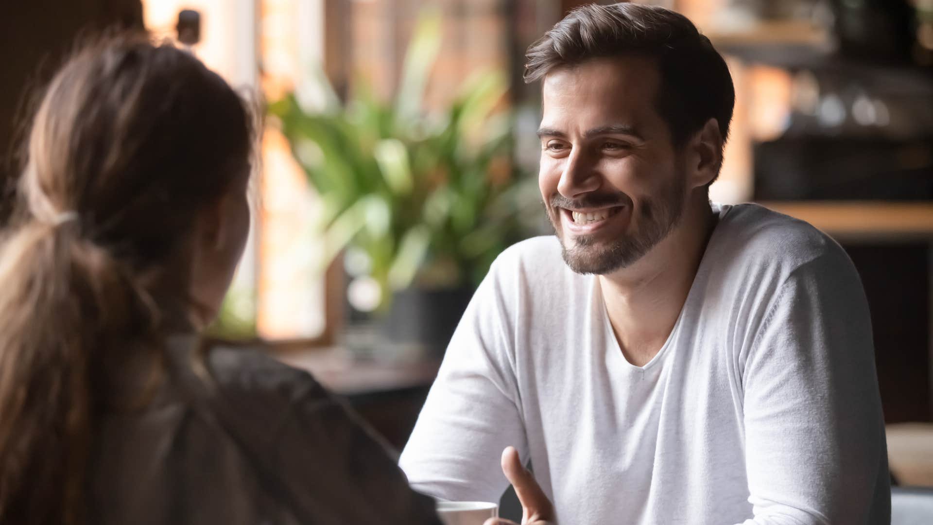 man listening to woman speak