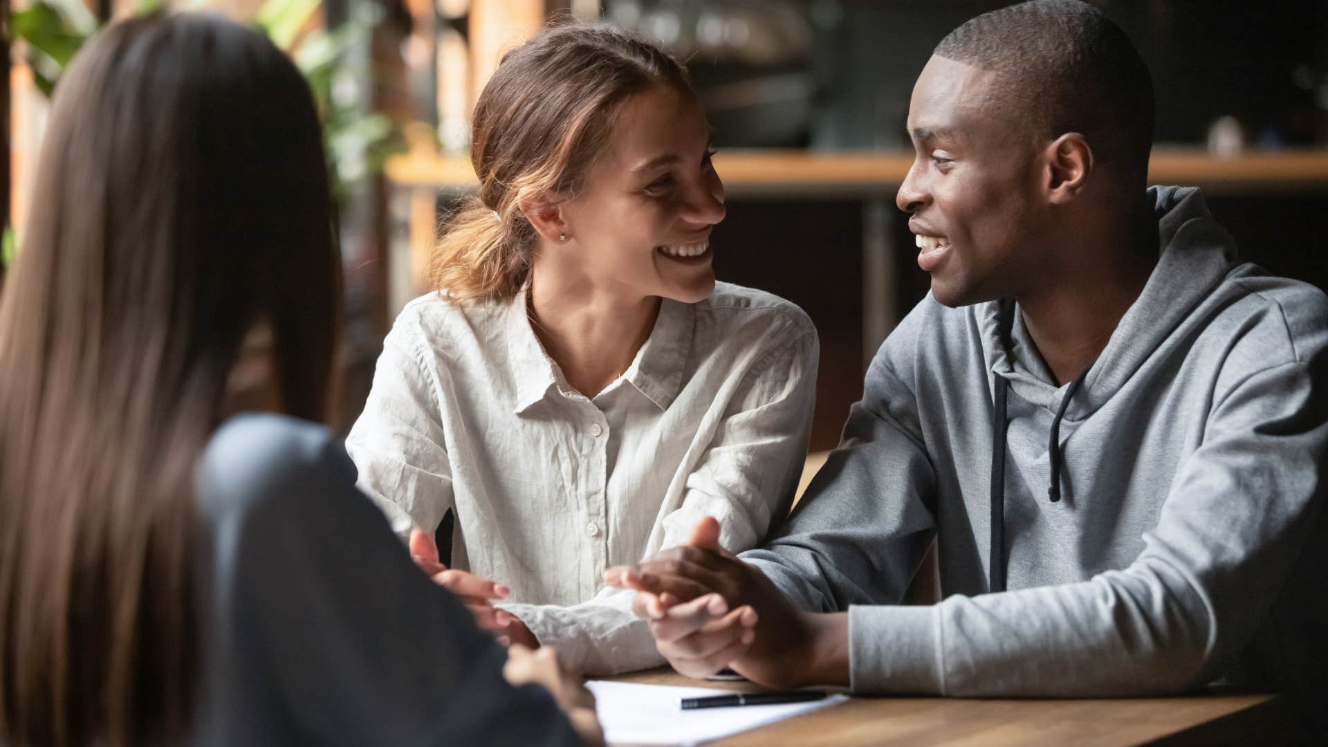 man talking to friends making them feel included