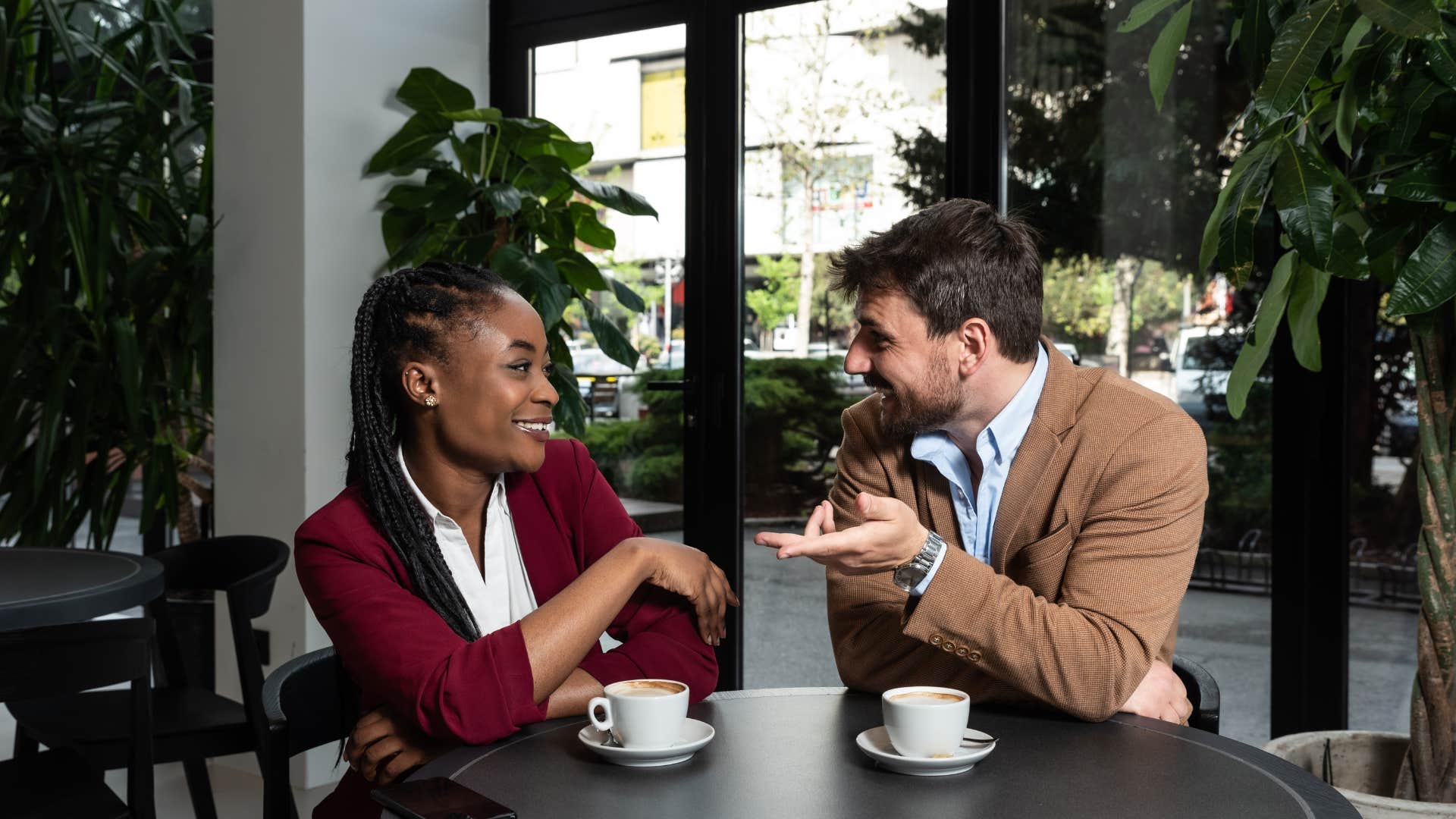 coworkers having conversation in cafe