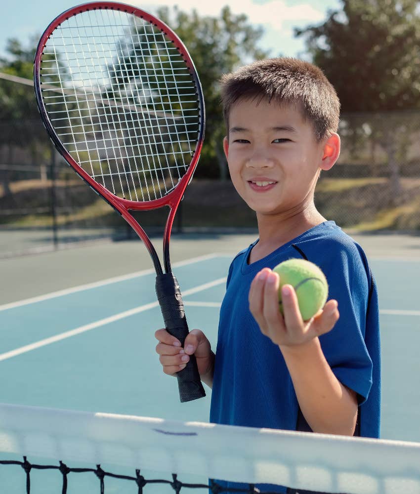 child playing tennis because he enjoys it