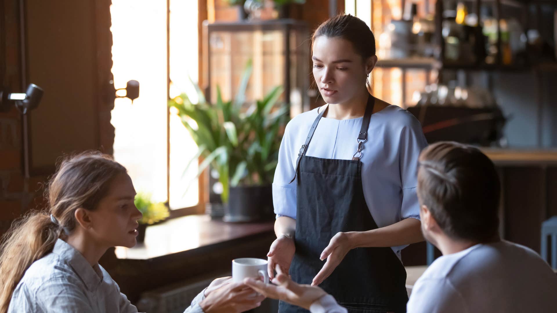 waitress being rude to customers at restaurant
