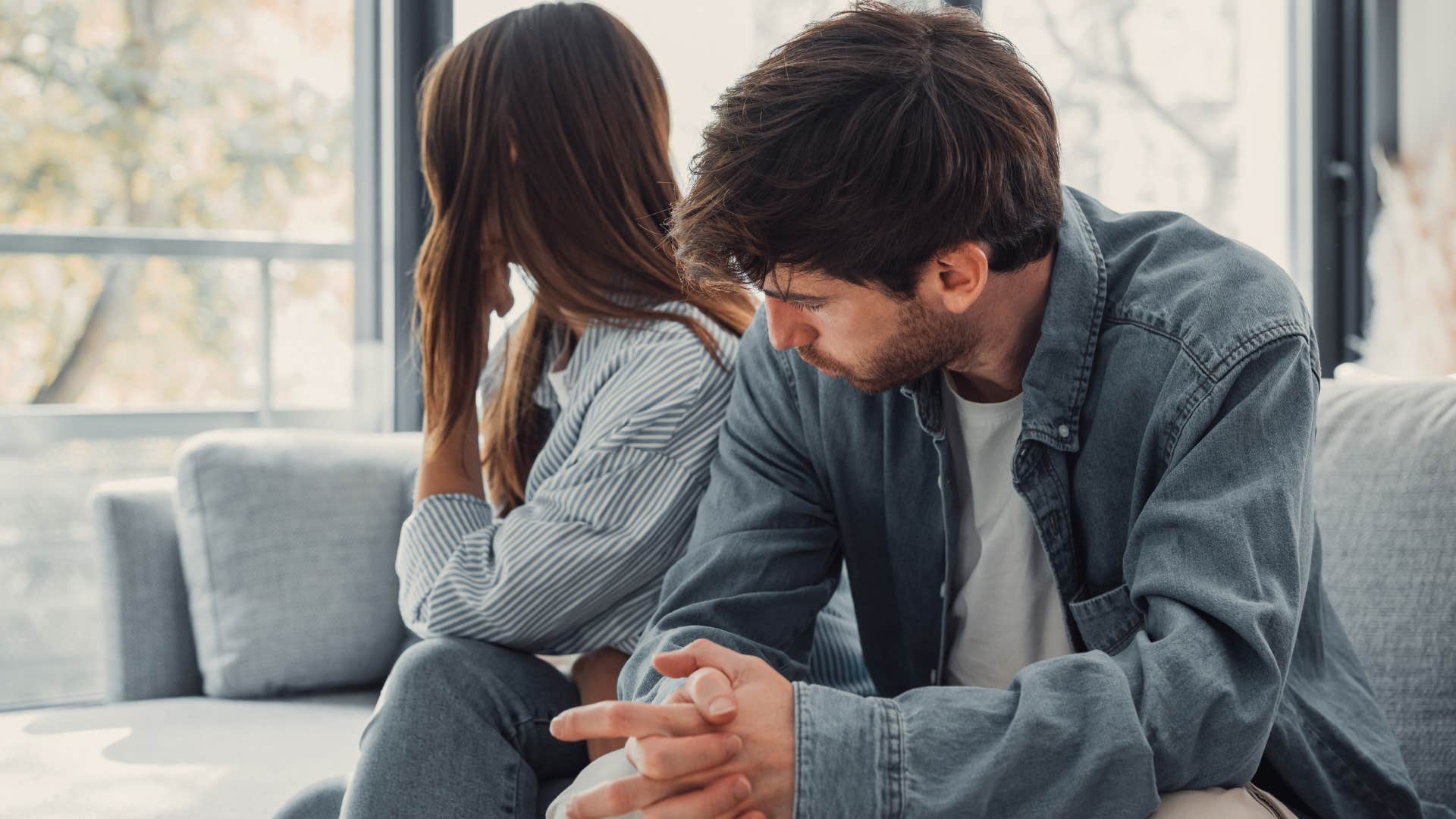 man being a scapegoat in an argument with his wife