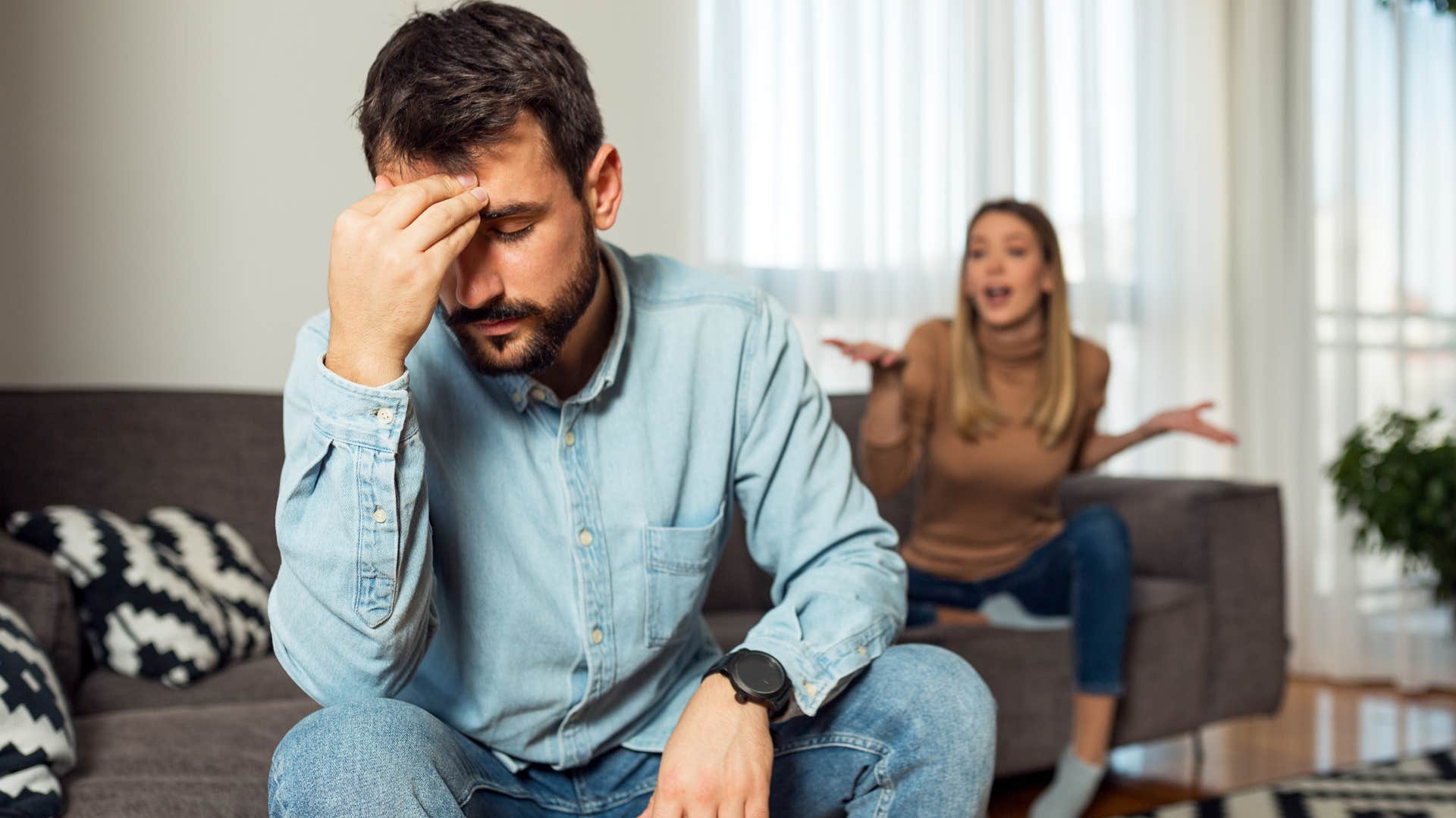 man who has lost his spark turned away from upset wife