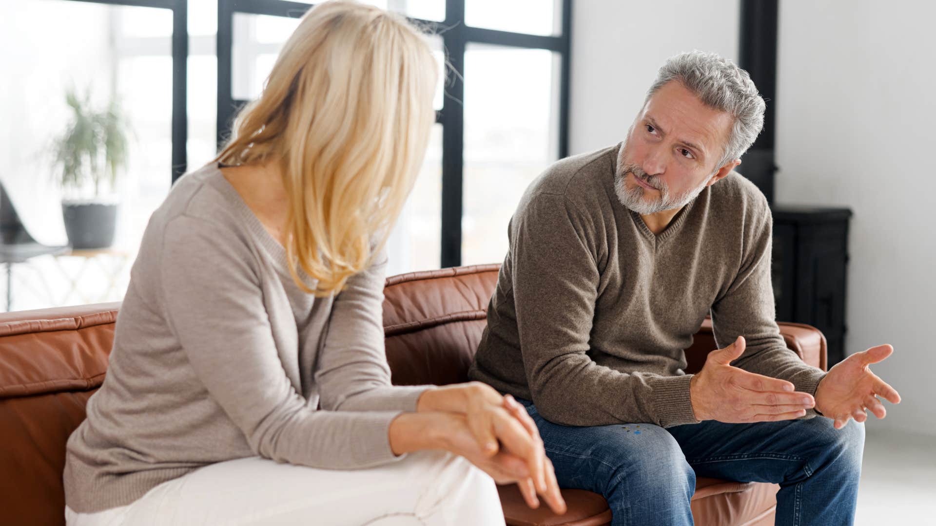 man arguing with his partner about not prioritizing quality time