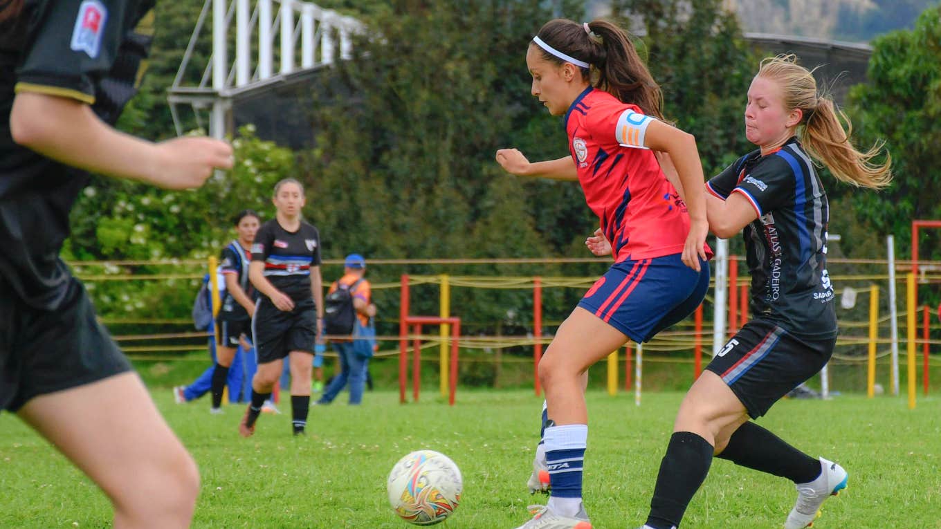 teen girls playing soccer