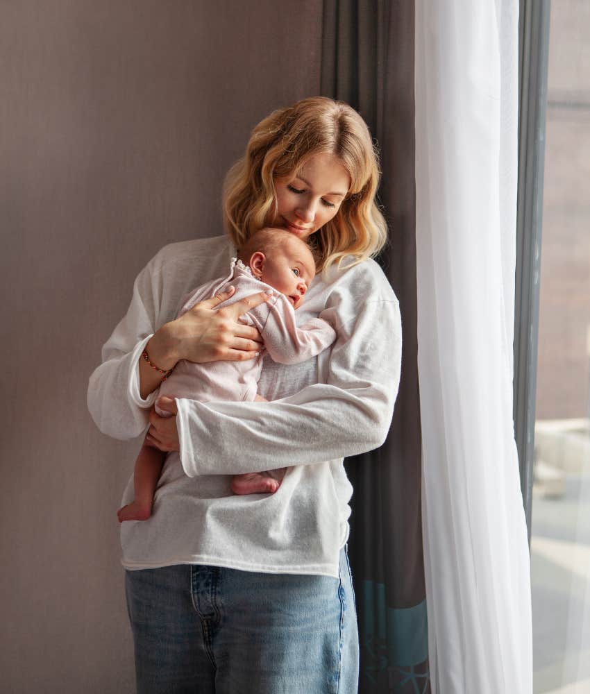New mom holding infant that she won't let mother-in-law take overnight