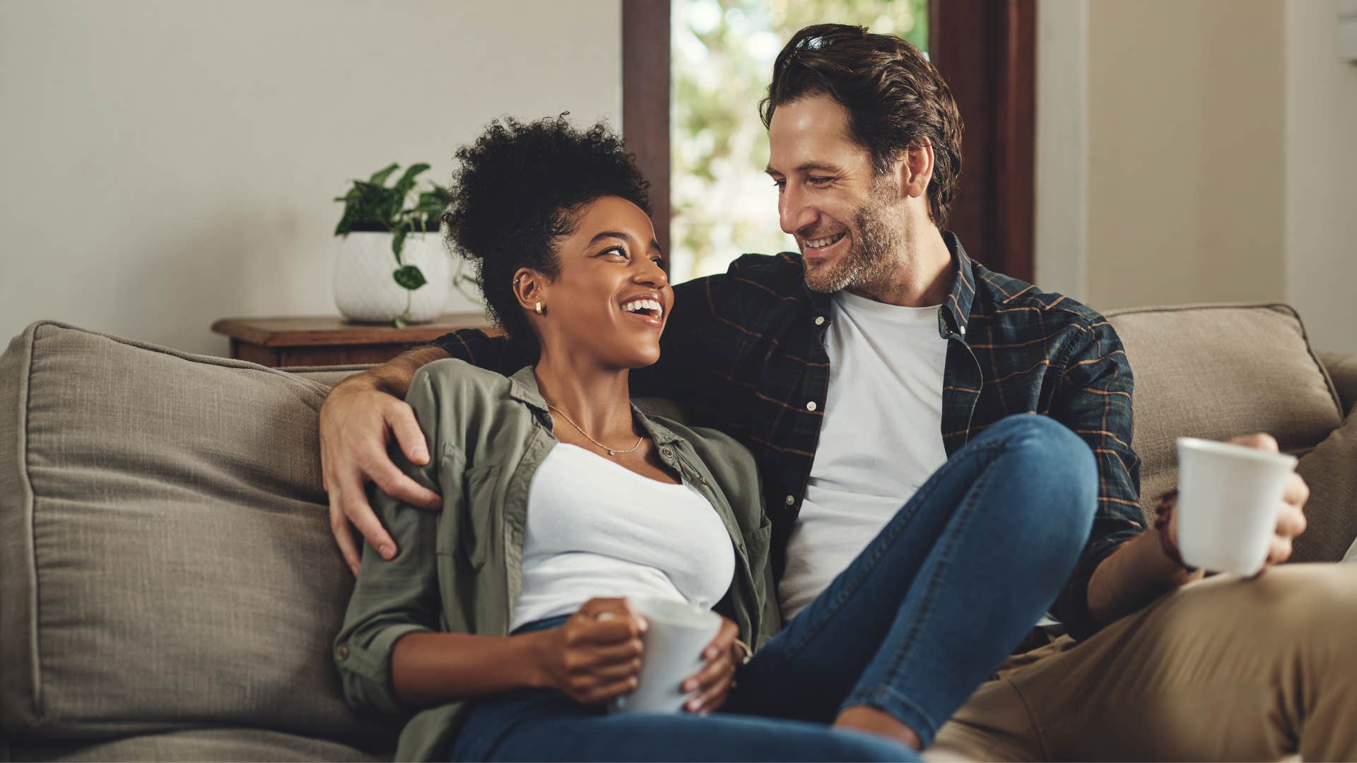 couple talking on the couch as woman always gets the last word in