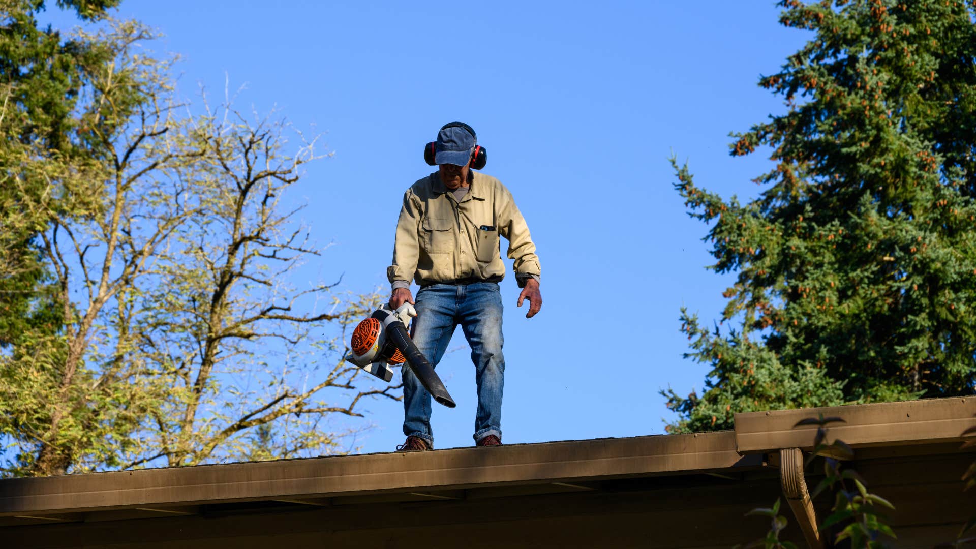 person over 60 still does the household task of Cleaning the gutters, making them exceptionally strong