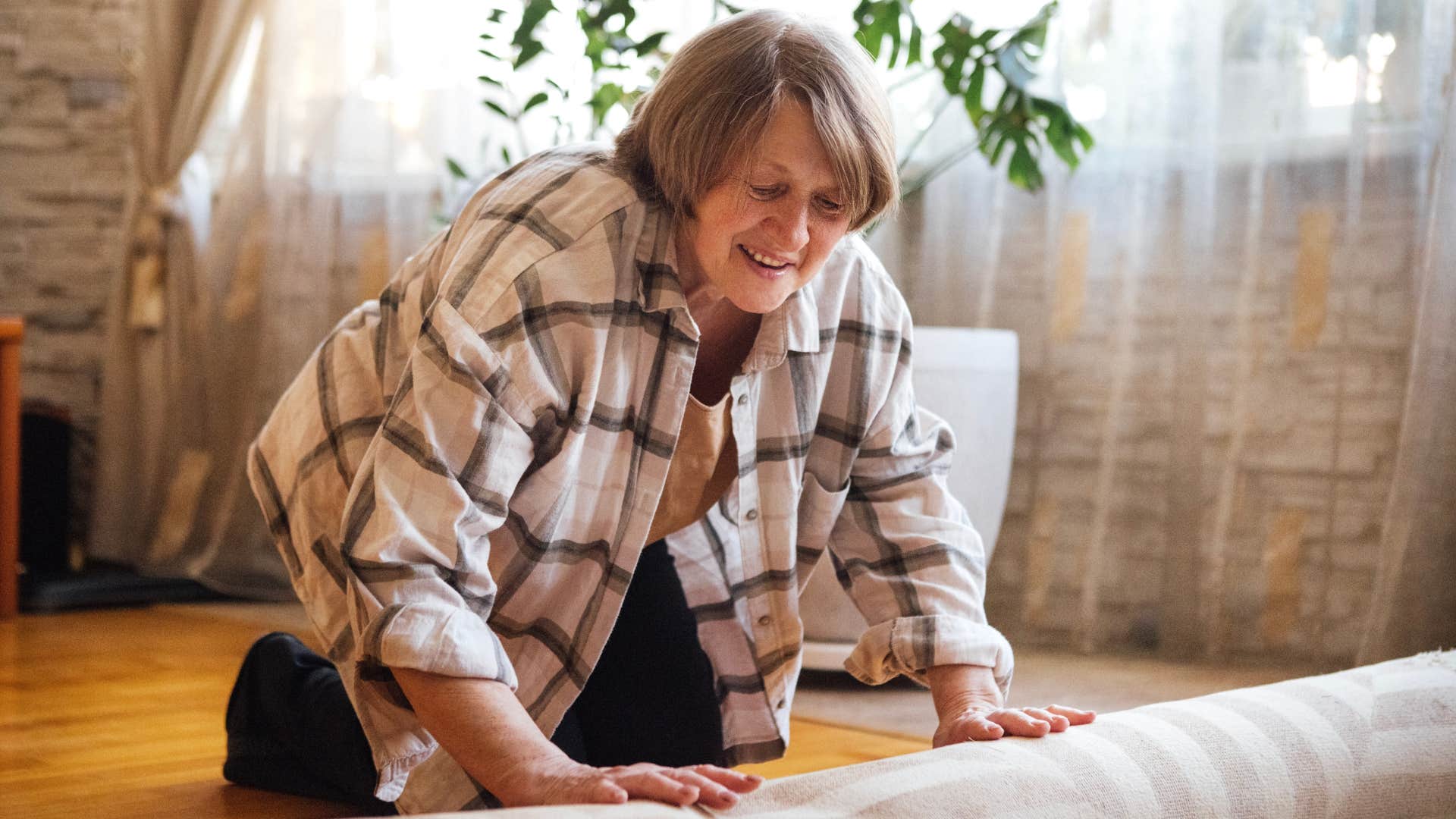 person over 60 still does the household task of Deep cleaning floors, making them exceptionally strong
