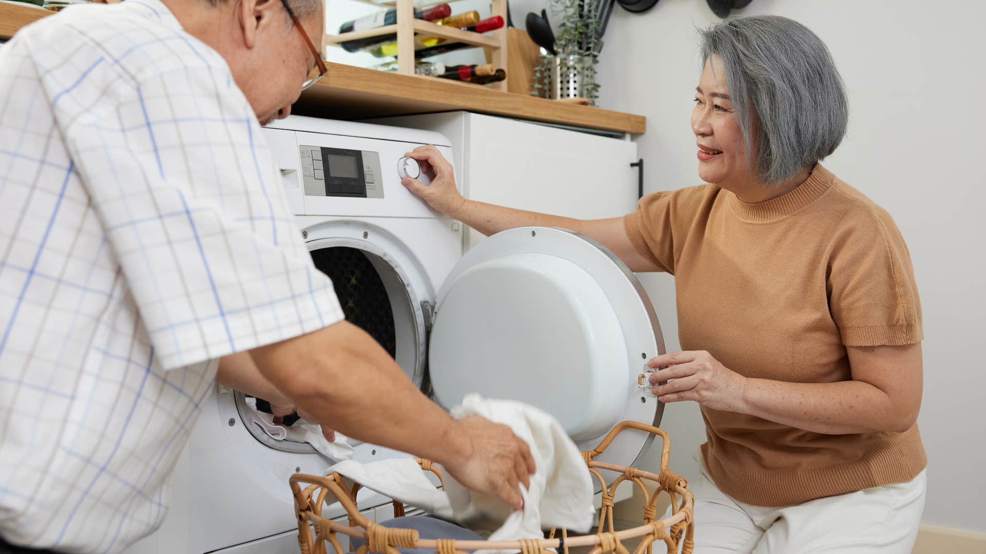 person over 60 still does the household task of Doing laundry for a huge household, making them exceptionally strong