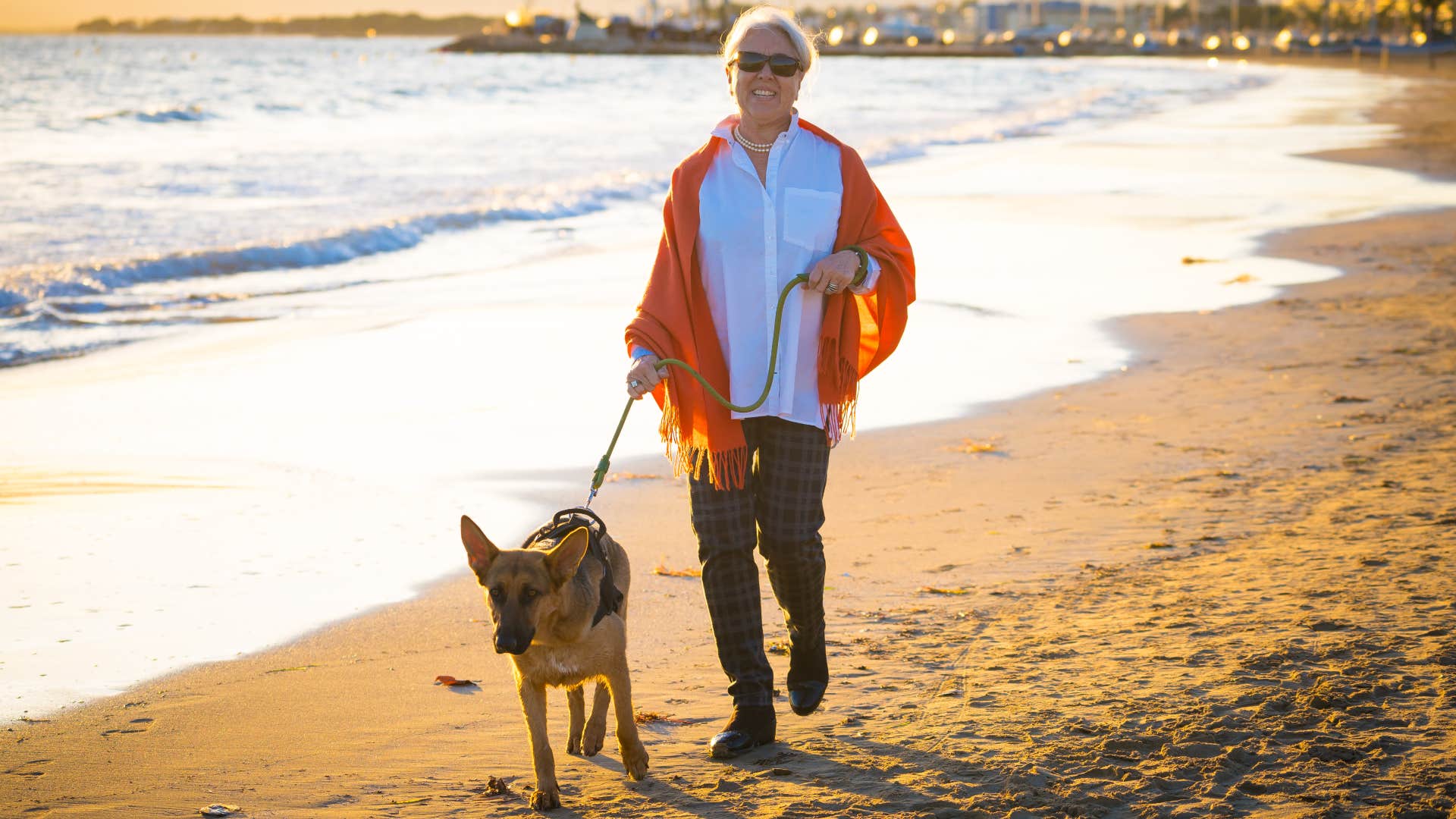 person over 60 still does the household task of Walking the dog multiple times a day, making them exceptionally strong