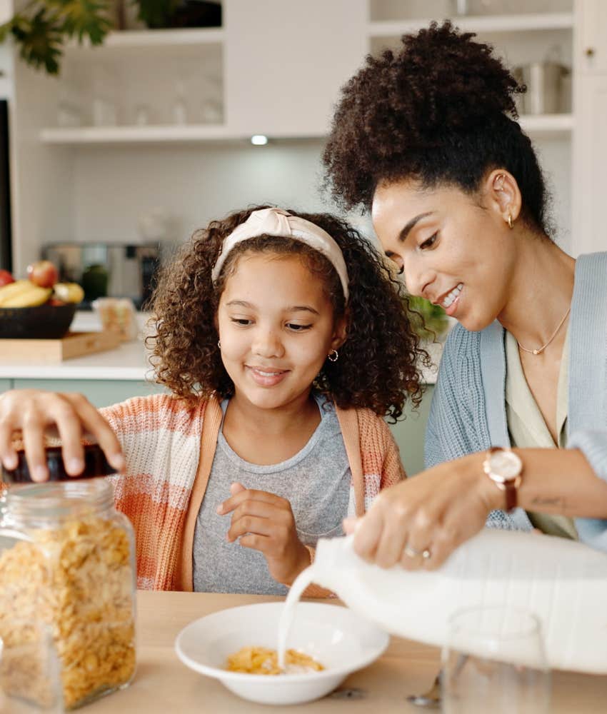 Parent and daughter get ready to eat