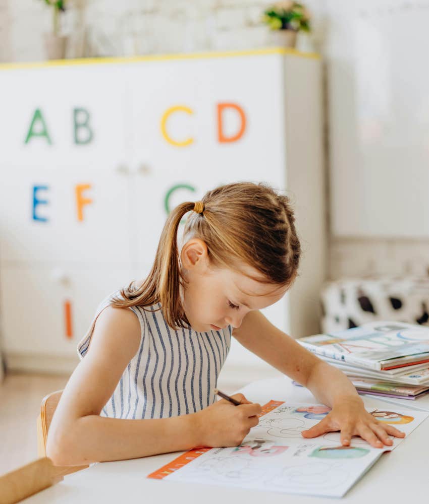 girl in elementary school working on an assignment