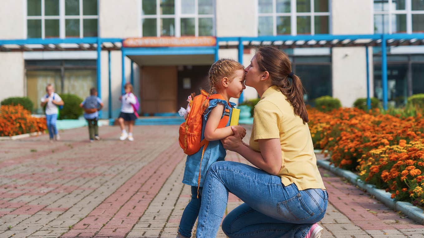 mom dropping her daughter off at elementary school