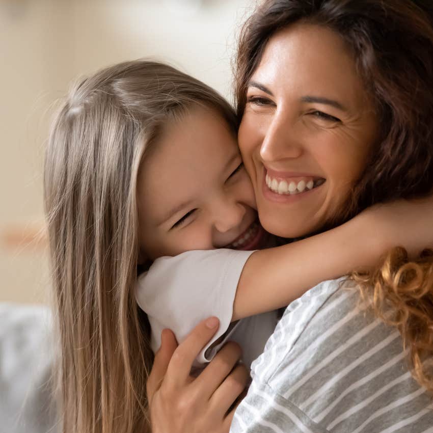 mother teaching child the skill emotional charades as she loves her unconditionally