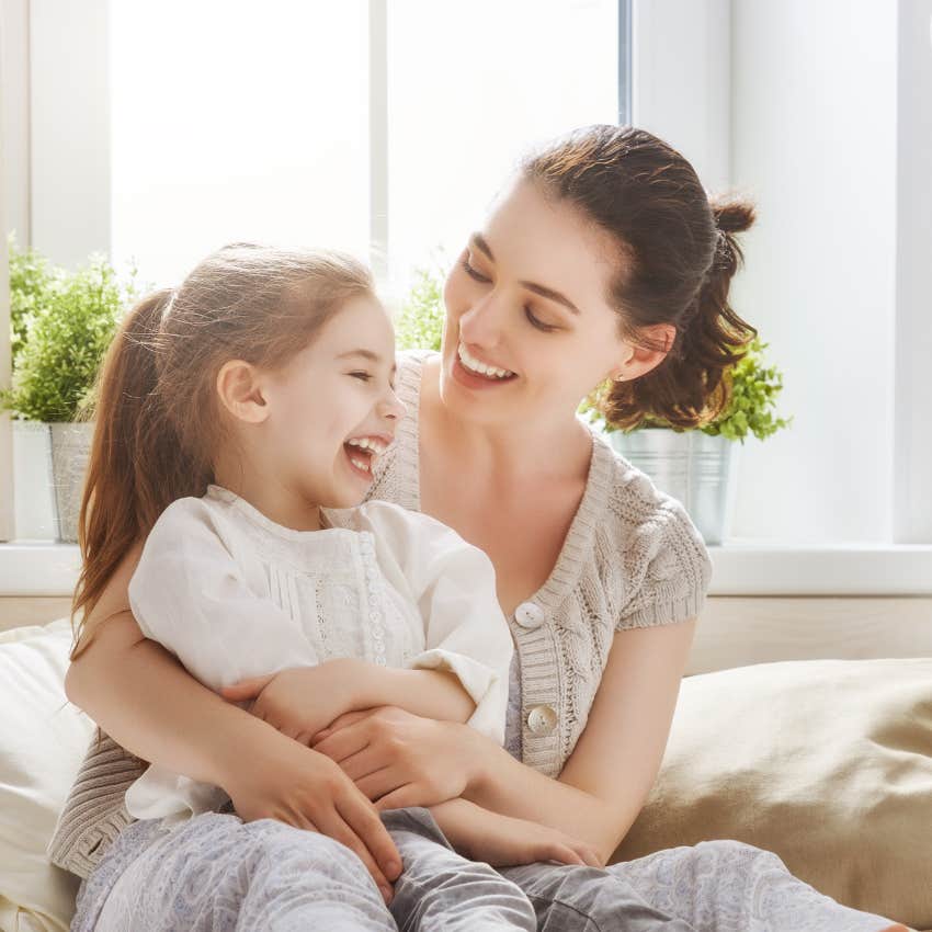 woman teaching child the skill of how to handle emotions as she loves her unconditionally