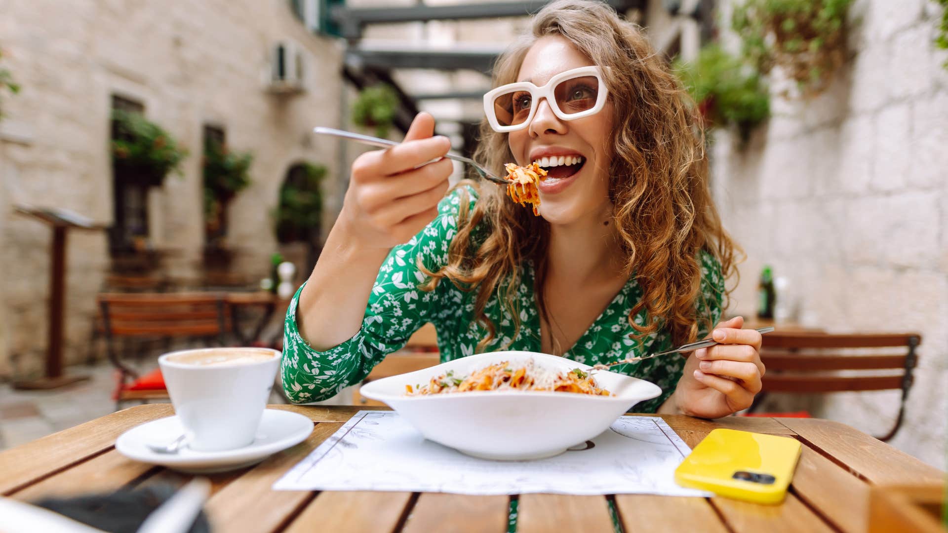 woman eating lunch at a restaurant