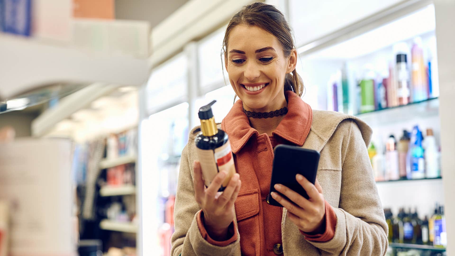 woman looking at bottled beauty product
