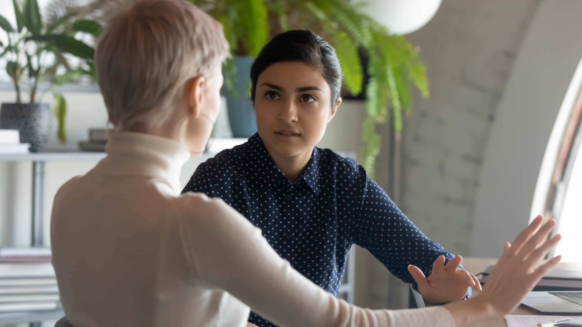 Woman saying "I don't get paid enough for this" to her boss.