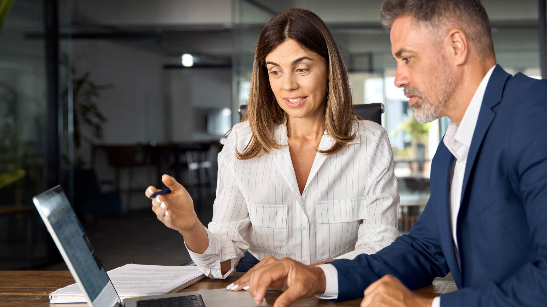 Woman saying "good luck with that" to a co-worker.