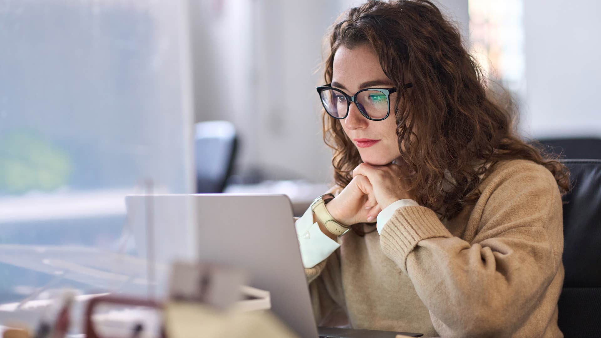 Woman saying "it doesn't matter" in a work meeting online.