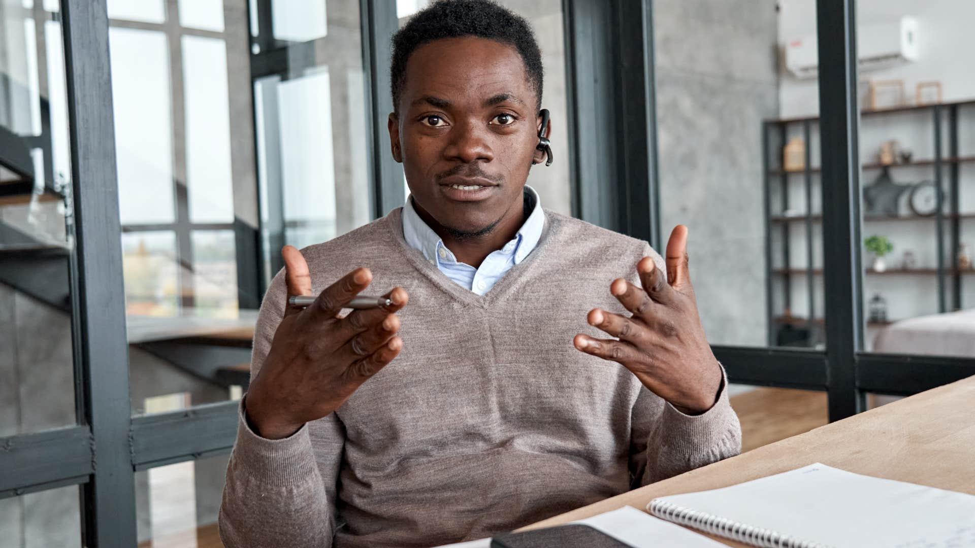 Man saying "just tell me what to do" during a work meeting.