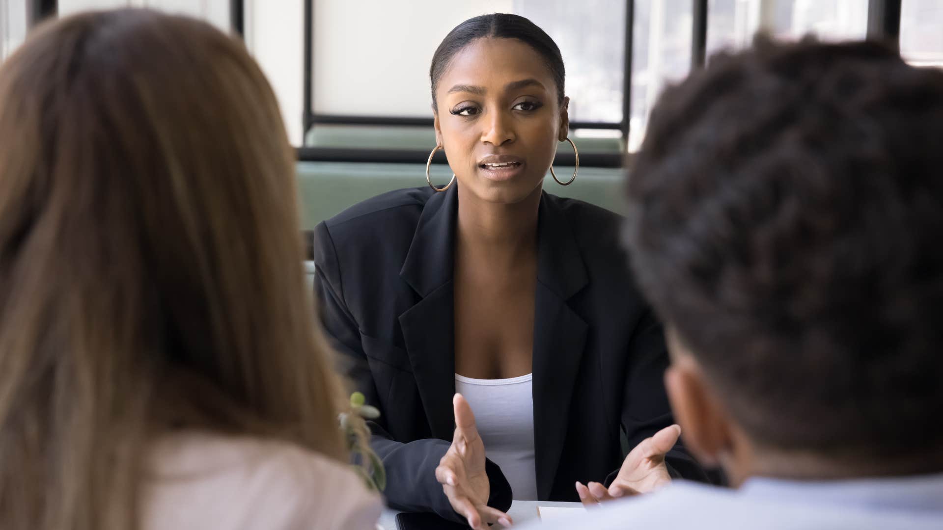Woman saying "that's wrong" during a work meeting.