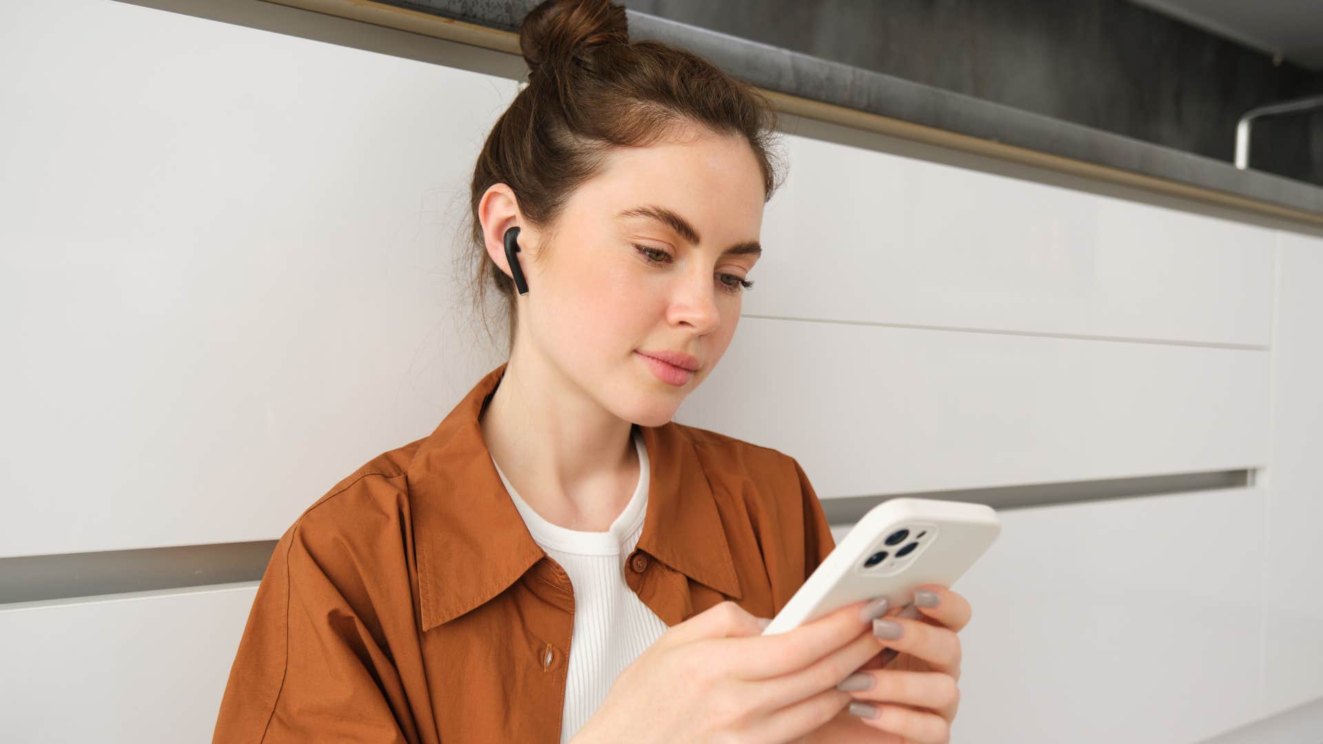 gen z woman making playlist on her phone