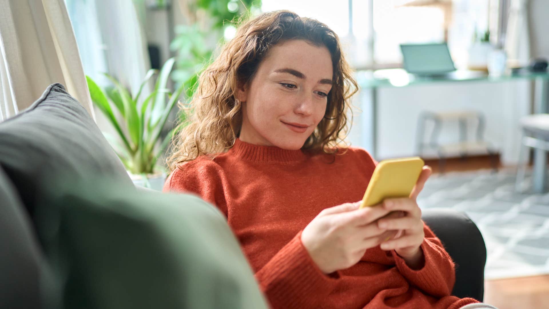 woman using dating app on phone