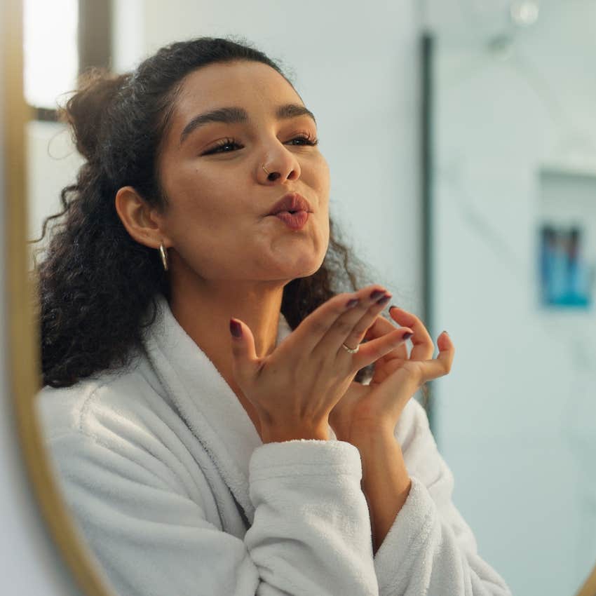 woman who radiates positivity by forgiving herself