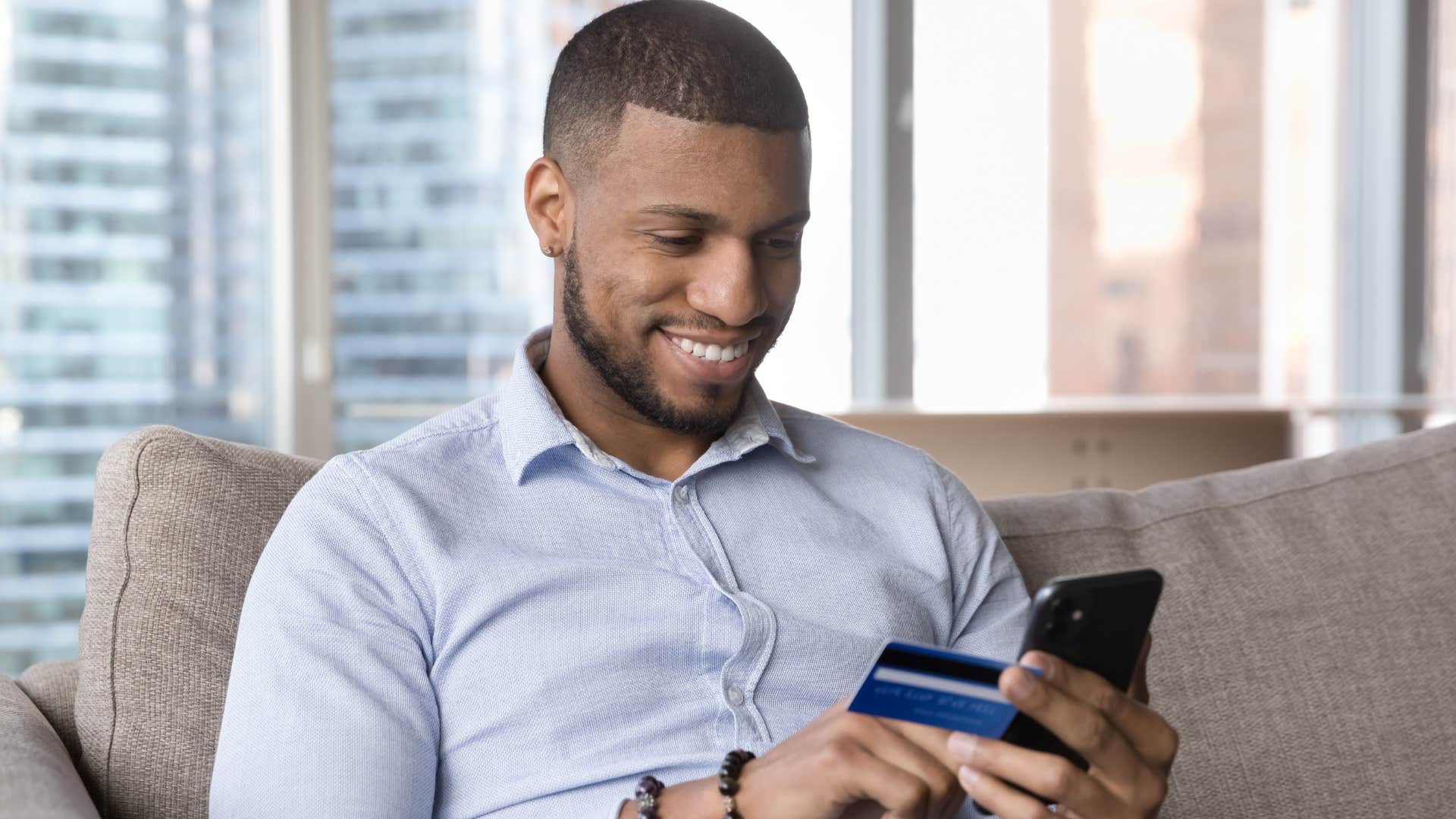 Man saying "it's not that expensive" while shopping online.