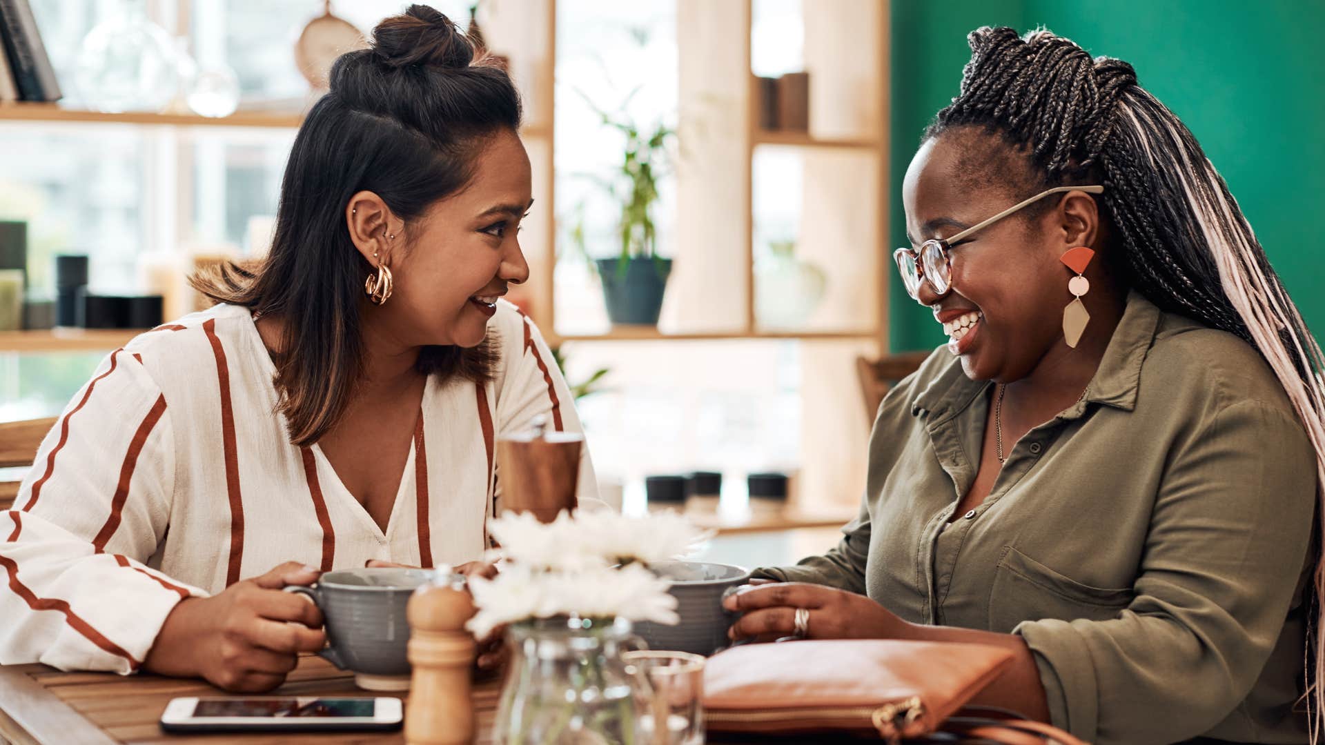 Woman smiling and saying "tomorrow isn't promised" to her friend.