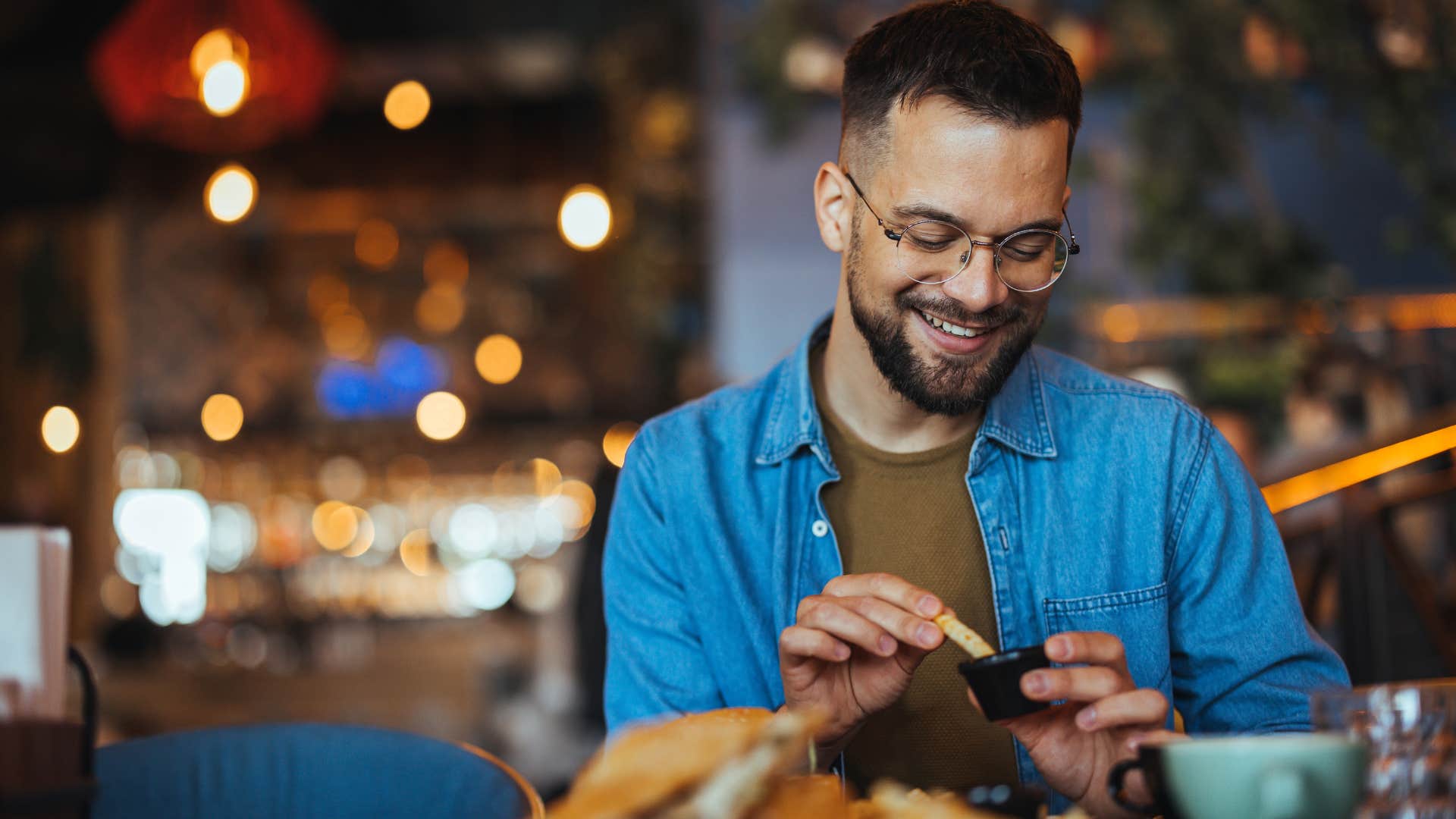 Man smiling while going out to eat.