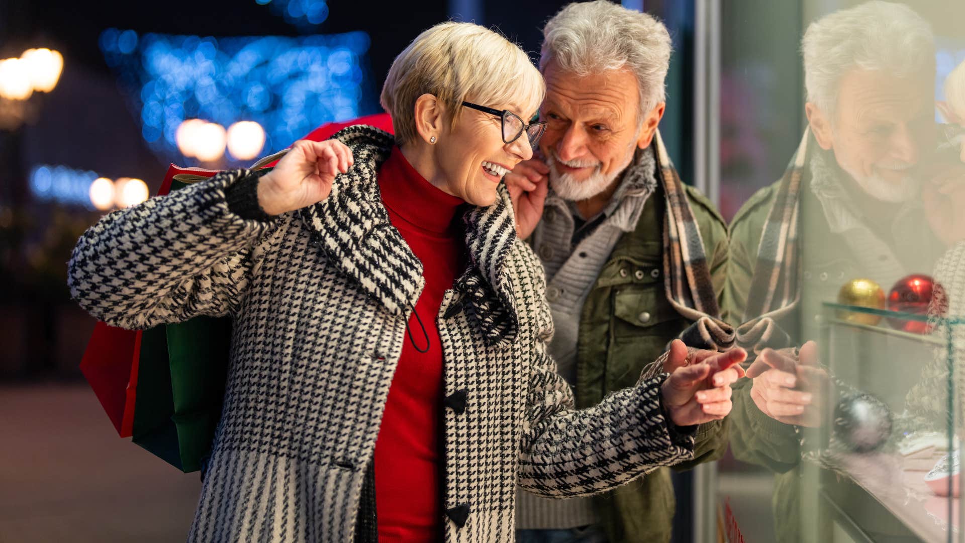 Woman giving into peer pressure looking in a shop window.