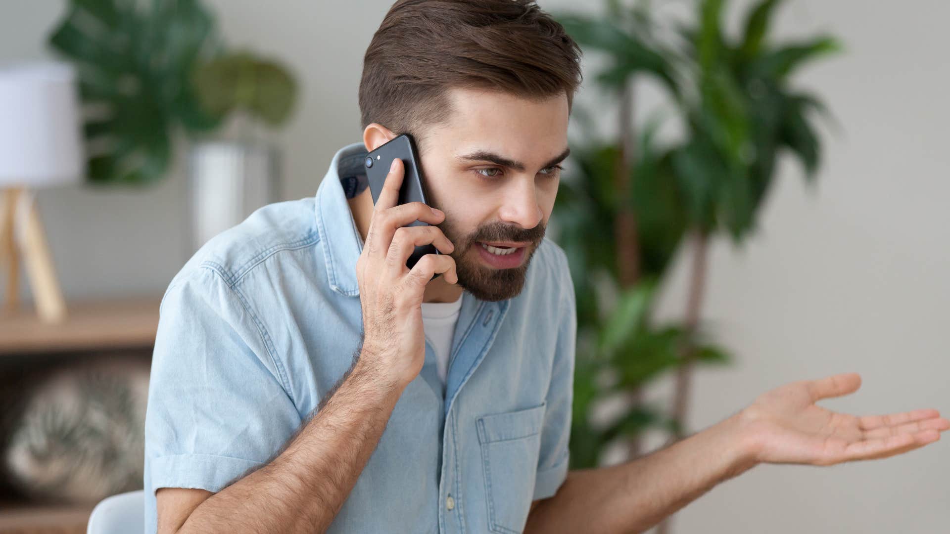 Upset man saying "that's not what I said" on the phone.