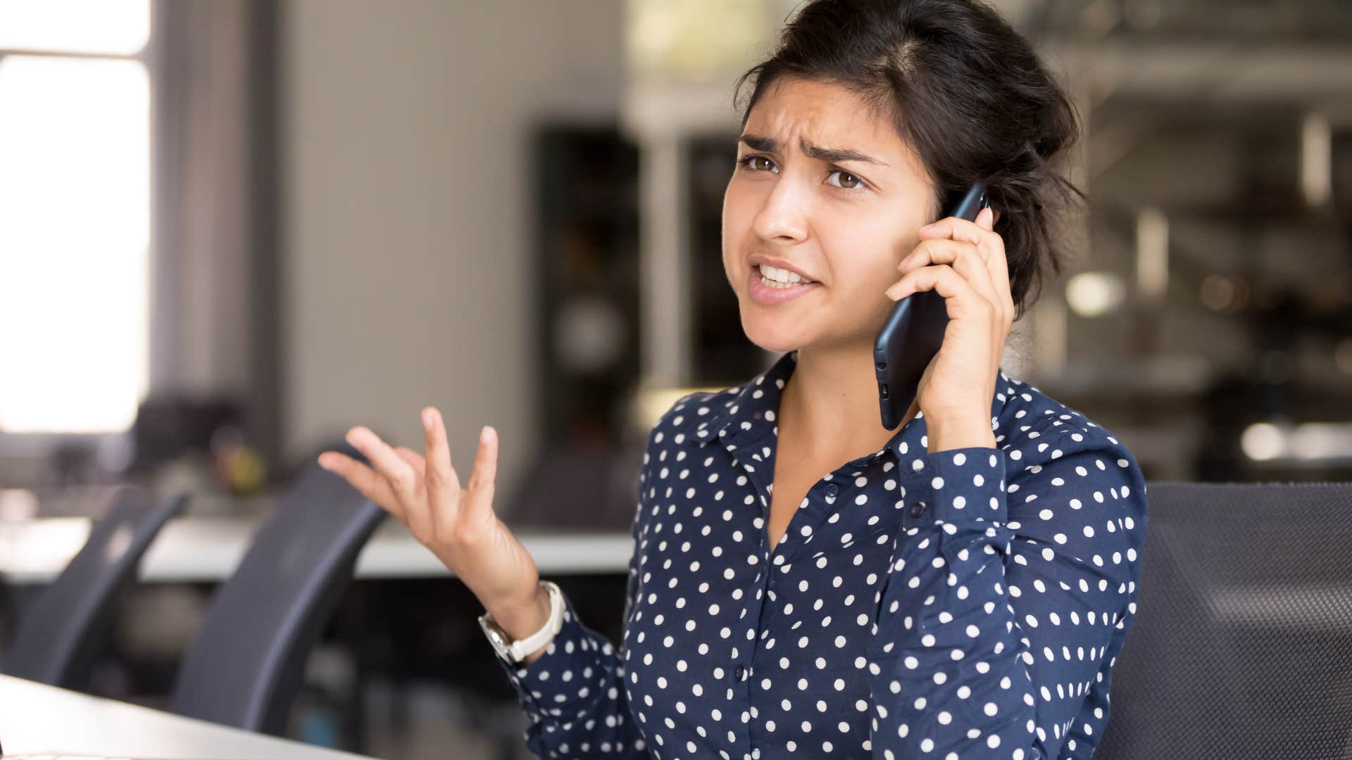 Woman saying "it's just the way I am" on the phone.