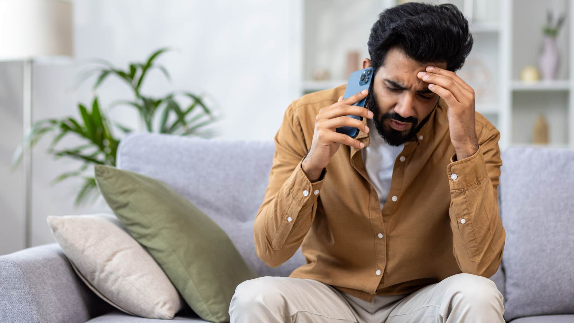 Man saying "that's not what I said" on his phone.