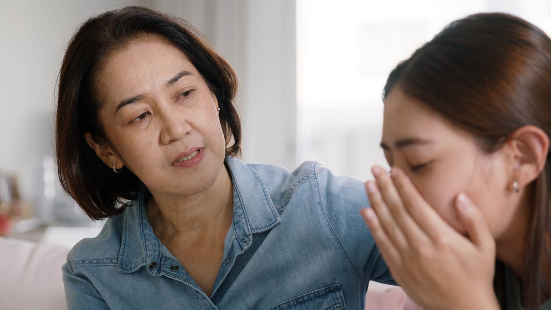 Woman saying "you're too sensitive" to her adult daughter.