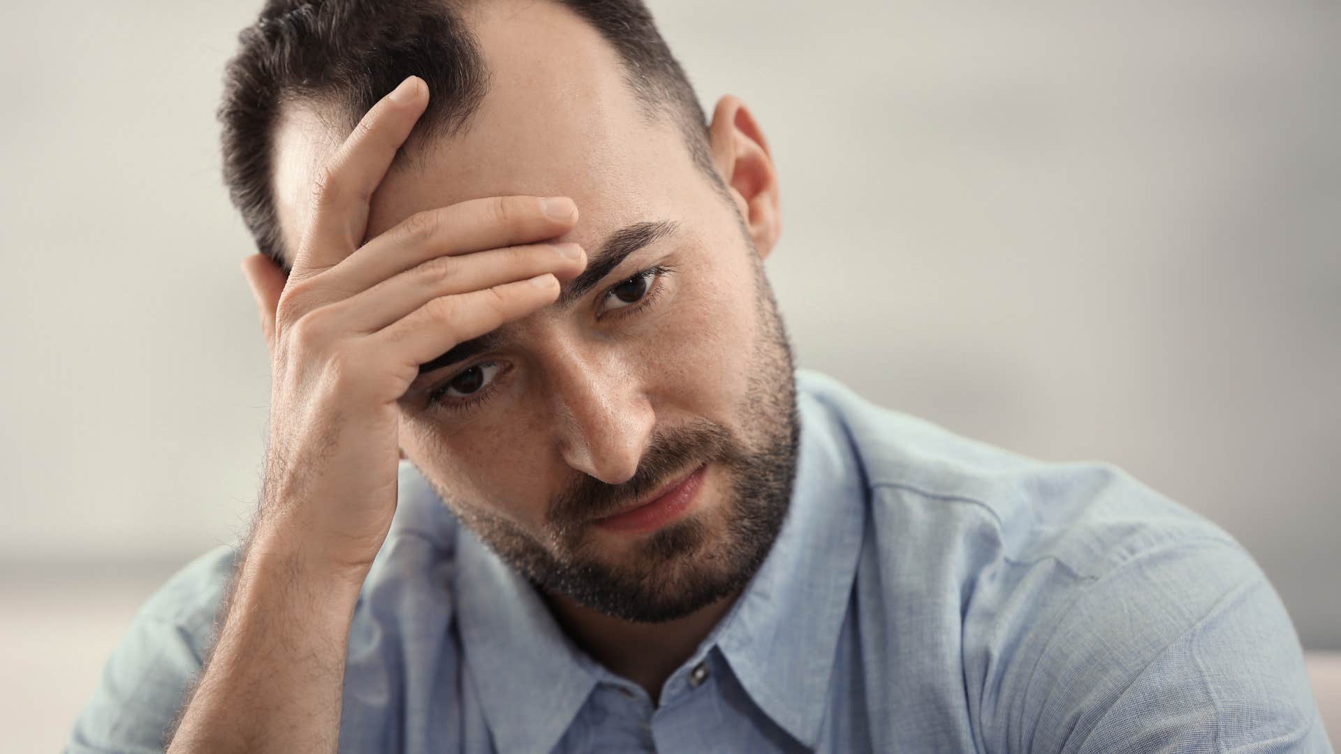stressed man not prioritizing his mental health