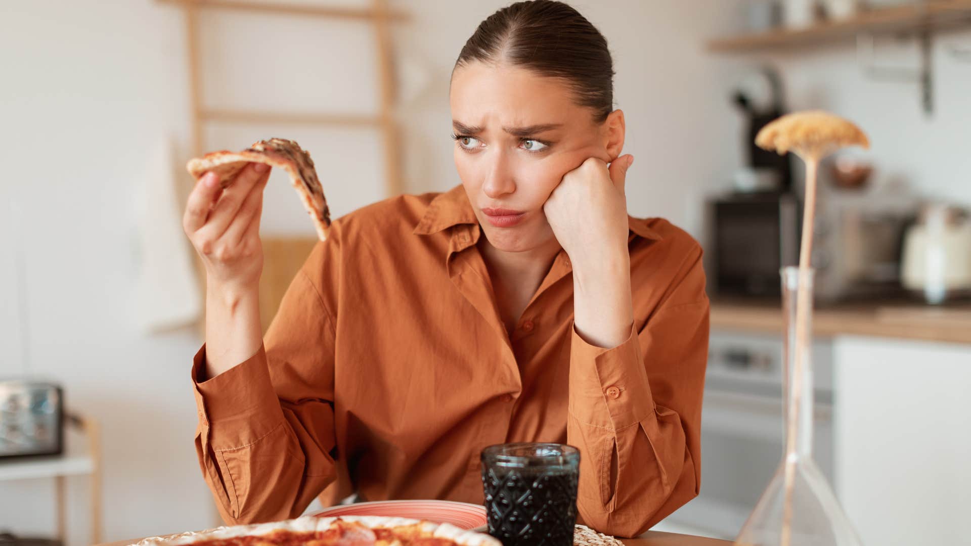 woman eating junk food instead of healthy