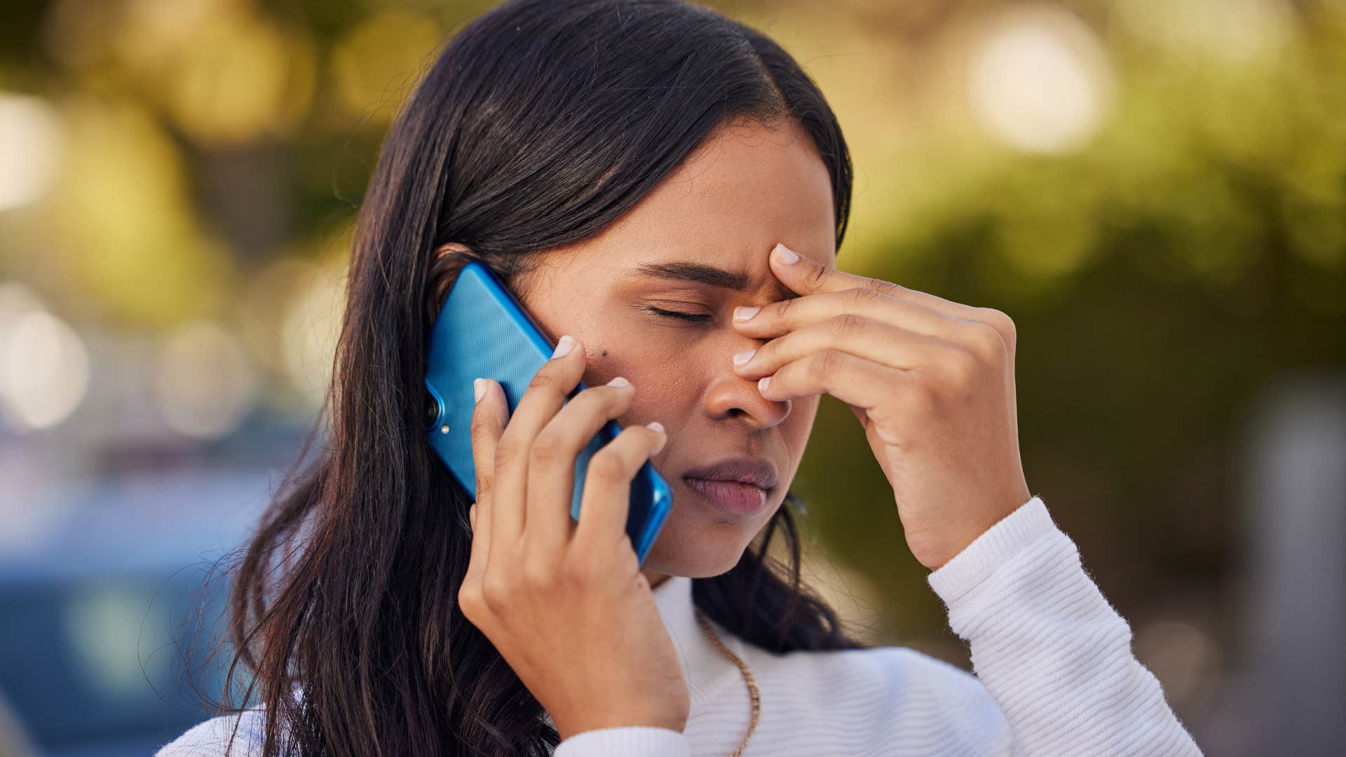 Woman who knows the news is too exhausting to keep up with talking on the phone.