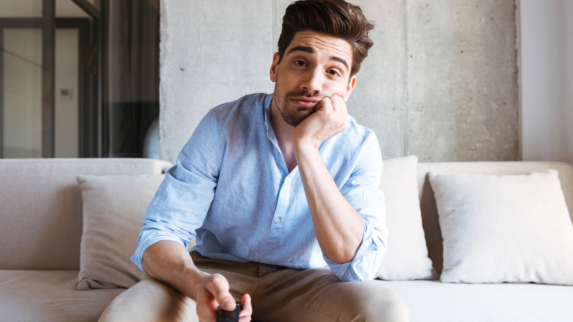 Man who's not interested in it watching TV.