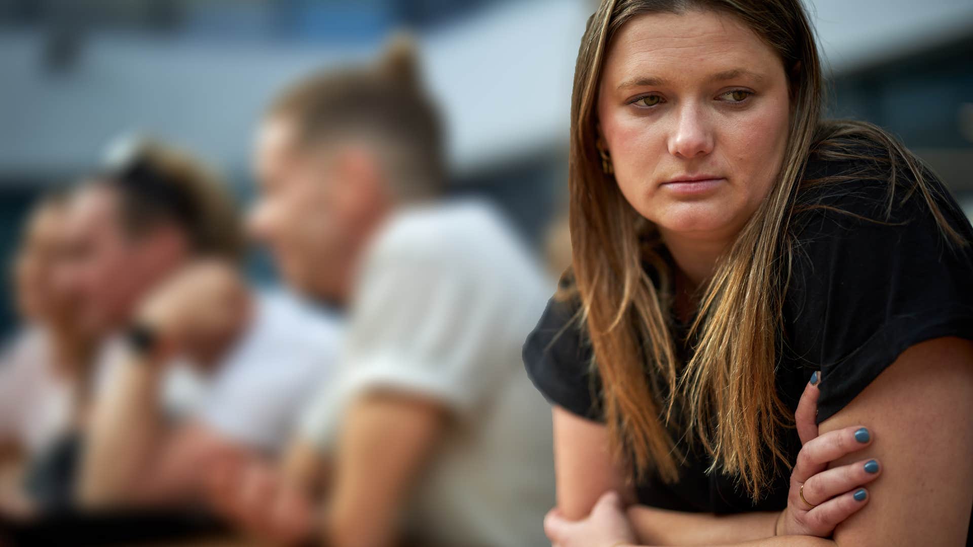 woman who feels like an outsider from her friend group