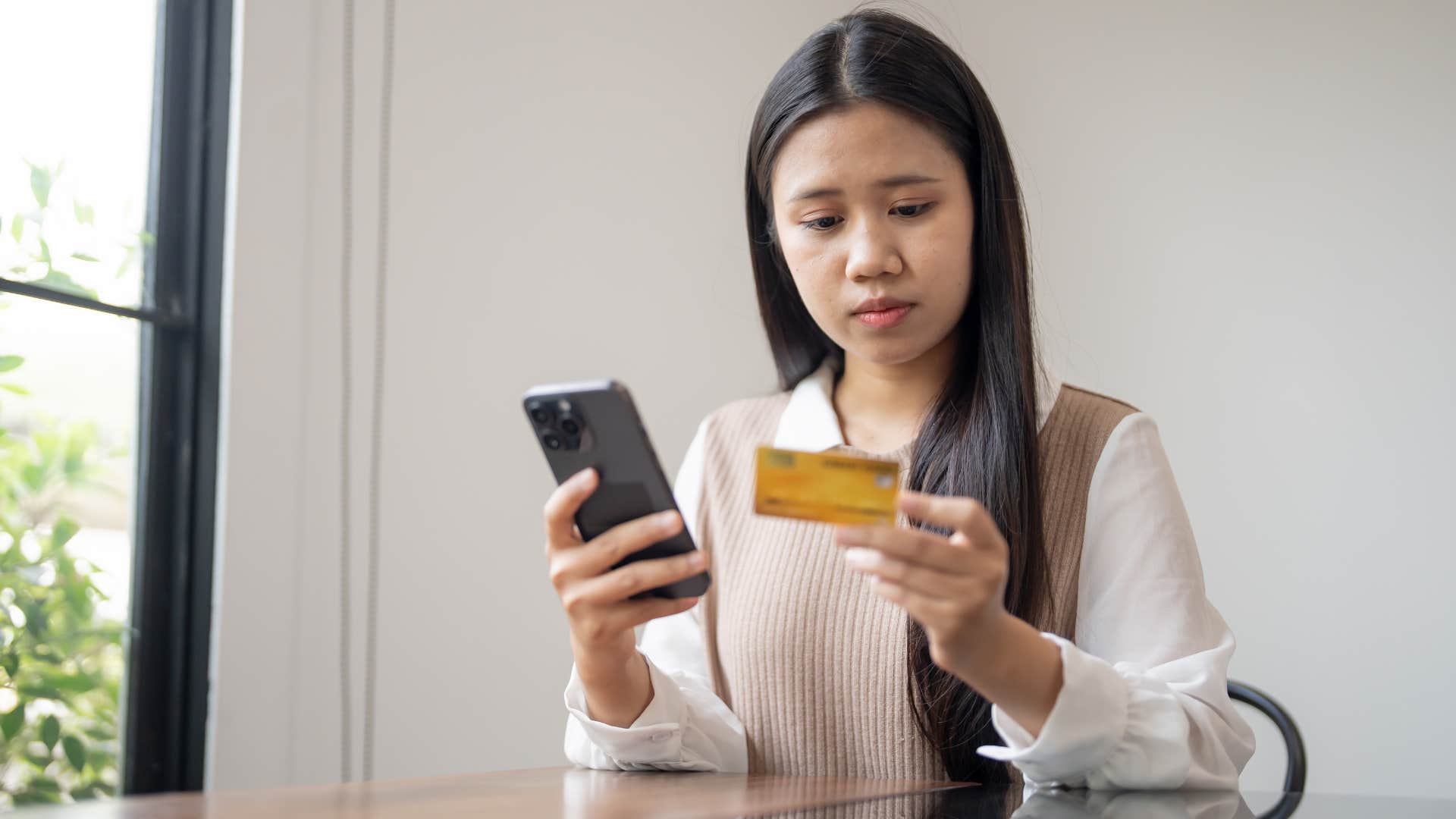 woman who lacks common sense using credit card because she deserves it